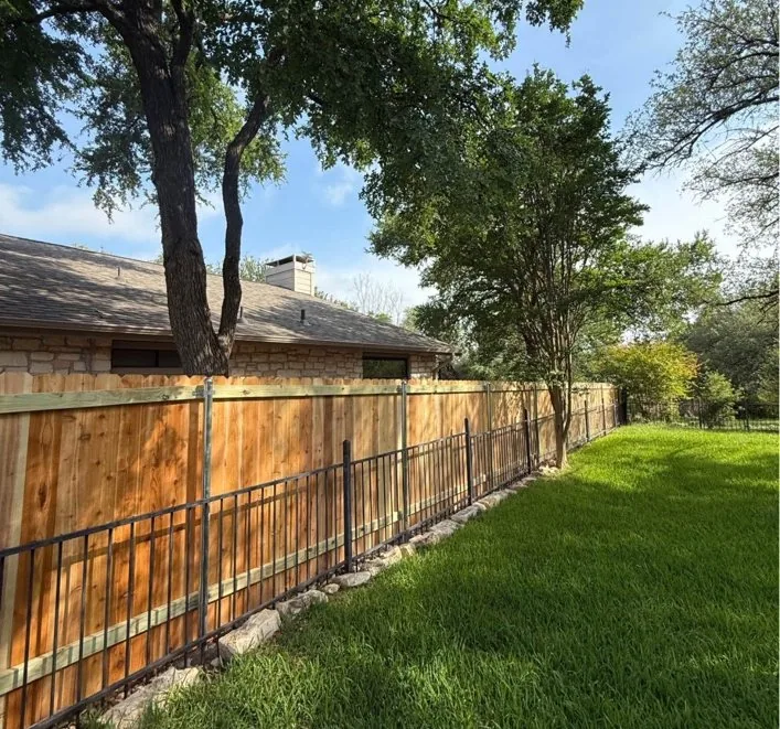 Cedar fence with decorative iron foreground